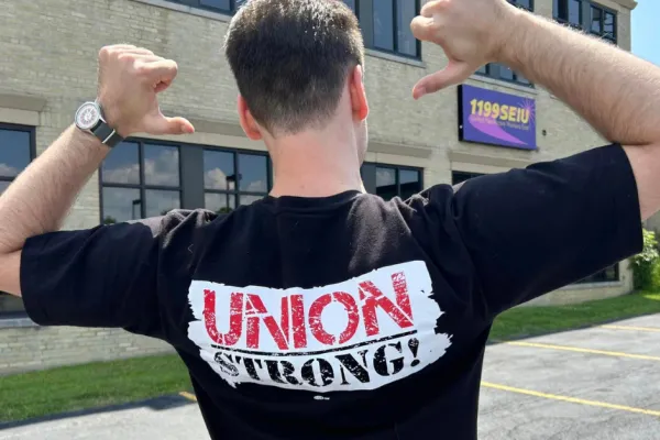 Man wearing t-shirt with Union Strong logo on the back