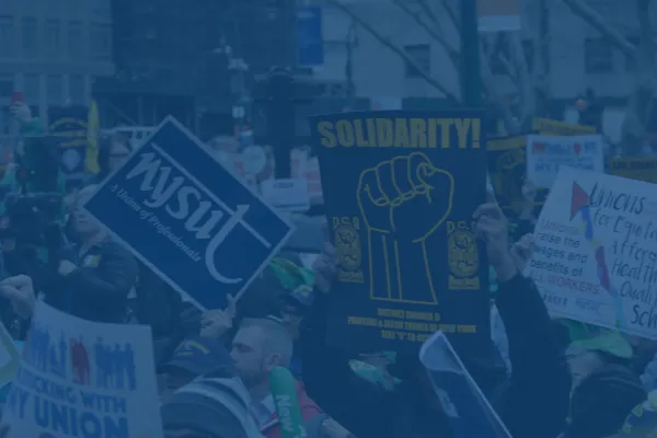 Photo of union signs at a rally with a dark blue overlay