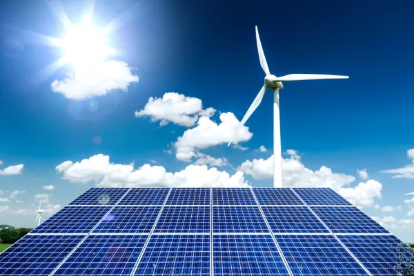 solar panel and wind turbine on sunny day