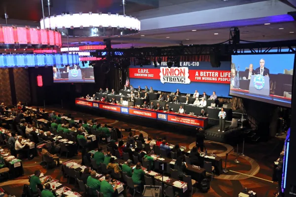 Aerial photo of 2022 COPE Convention stage and first few delegate rows