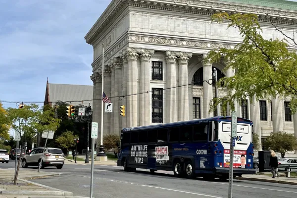 Bus with large Union Strong advertisement in Downtown Albany, NY
