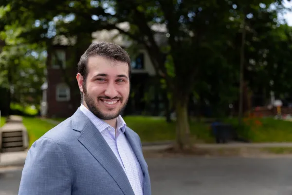 Headshot of Sam Berger outside on a nice day