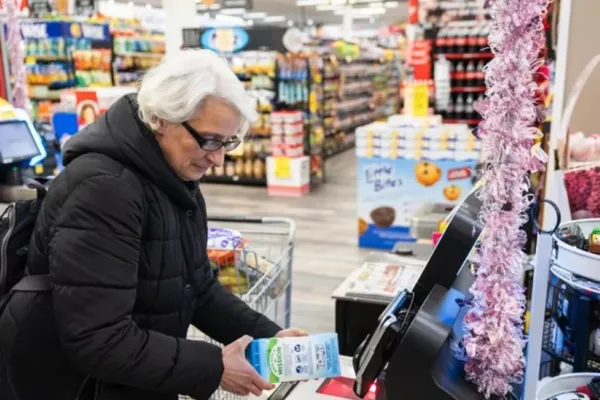 Franklin Square resident Ana Gioia uses a self-checkout register at the Holiday Farms supermarket in Franklin Square.  Credit: Corey Sipkin