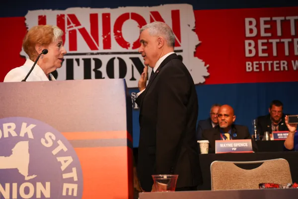 Mario Cilento being sworn in by Roberta Reardon