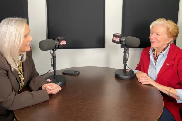 Darcy Wells and Commissioner Reardon talking in podcast studio