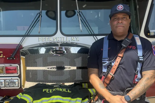 photo of Mark Carter in front of fire truck