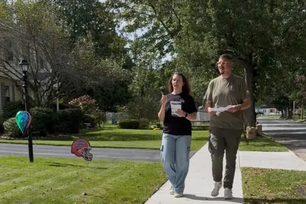 two volunteers walking at labor walk