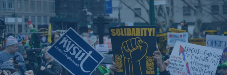 Signs at a labor rally with blue overlay