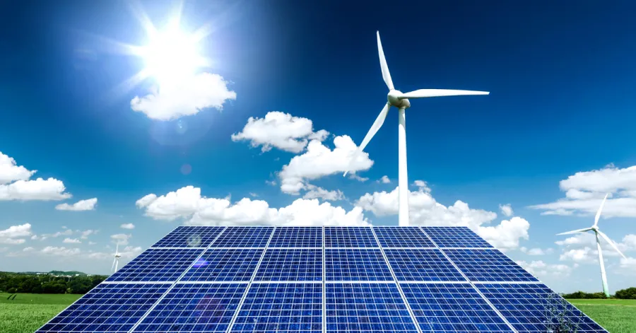 solar panel and wind turbine on sunny day