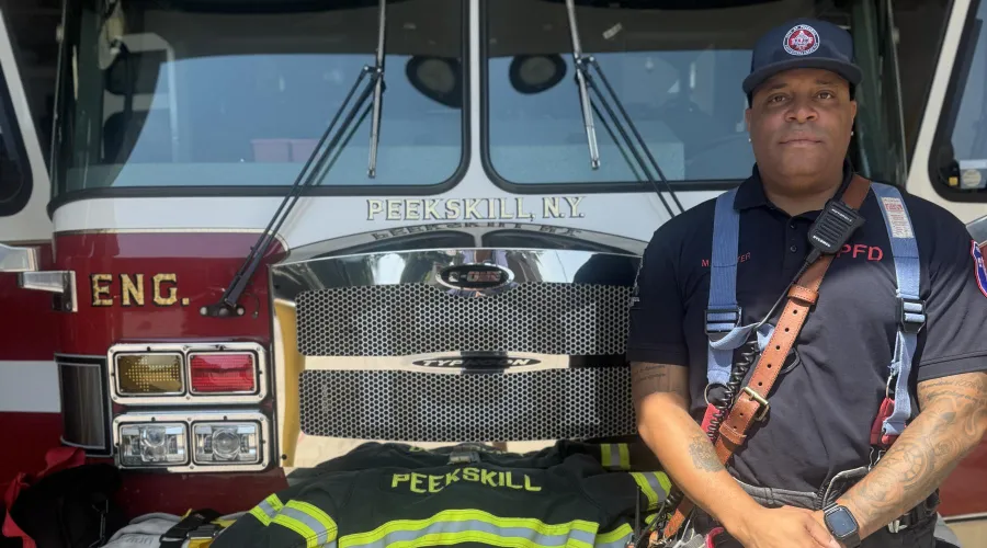 photo of Mark Carter in front of fire truck
