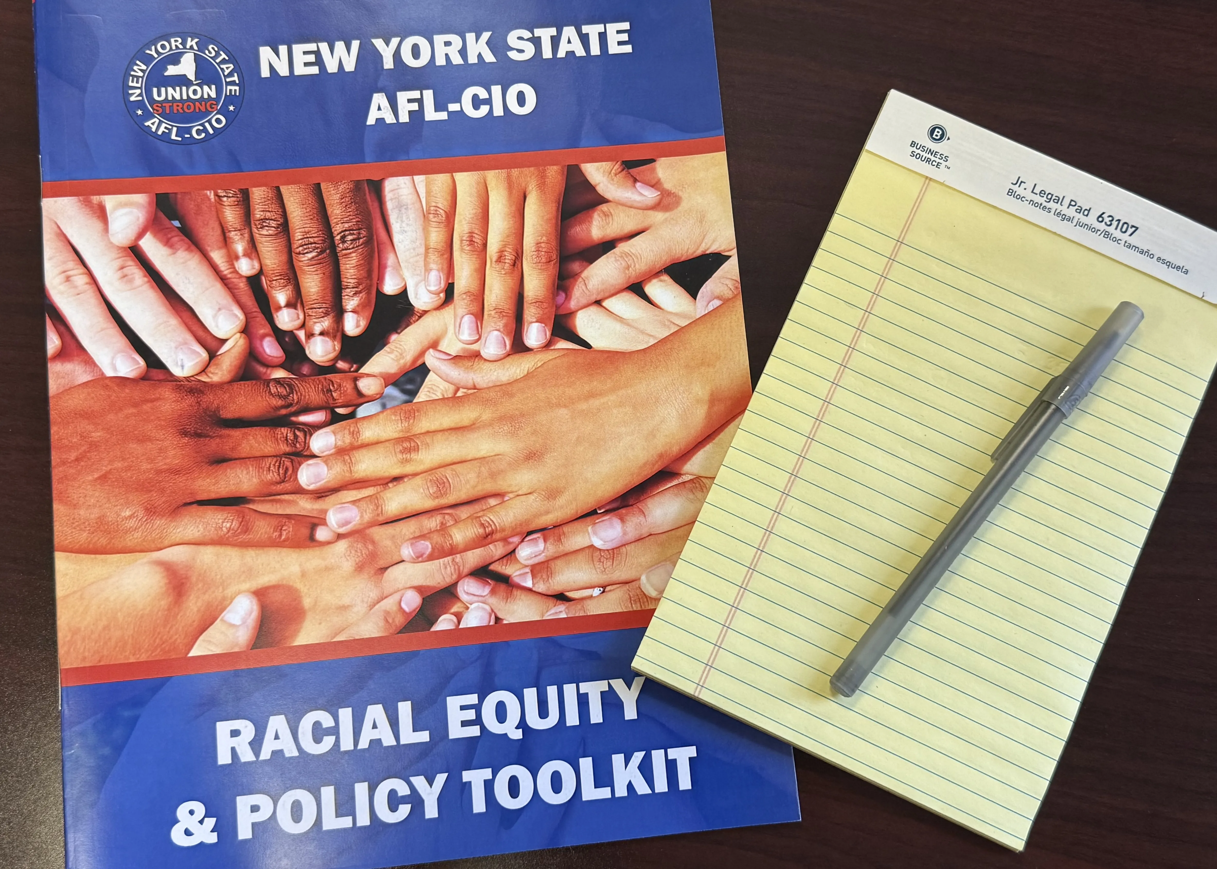 photo of NYS AFL-CIO Racial Equity and Policy Toolkit with notepad and pen