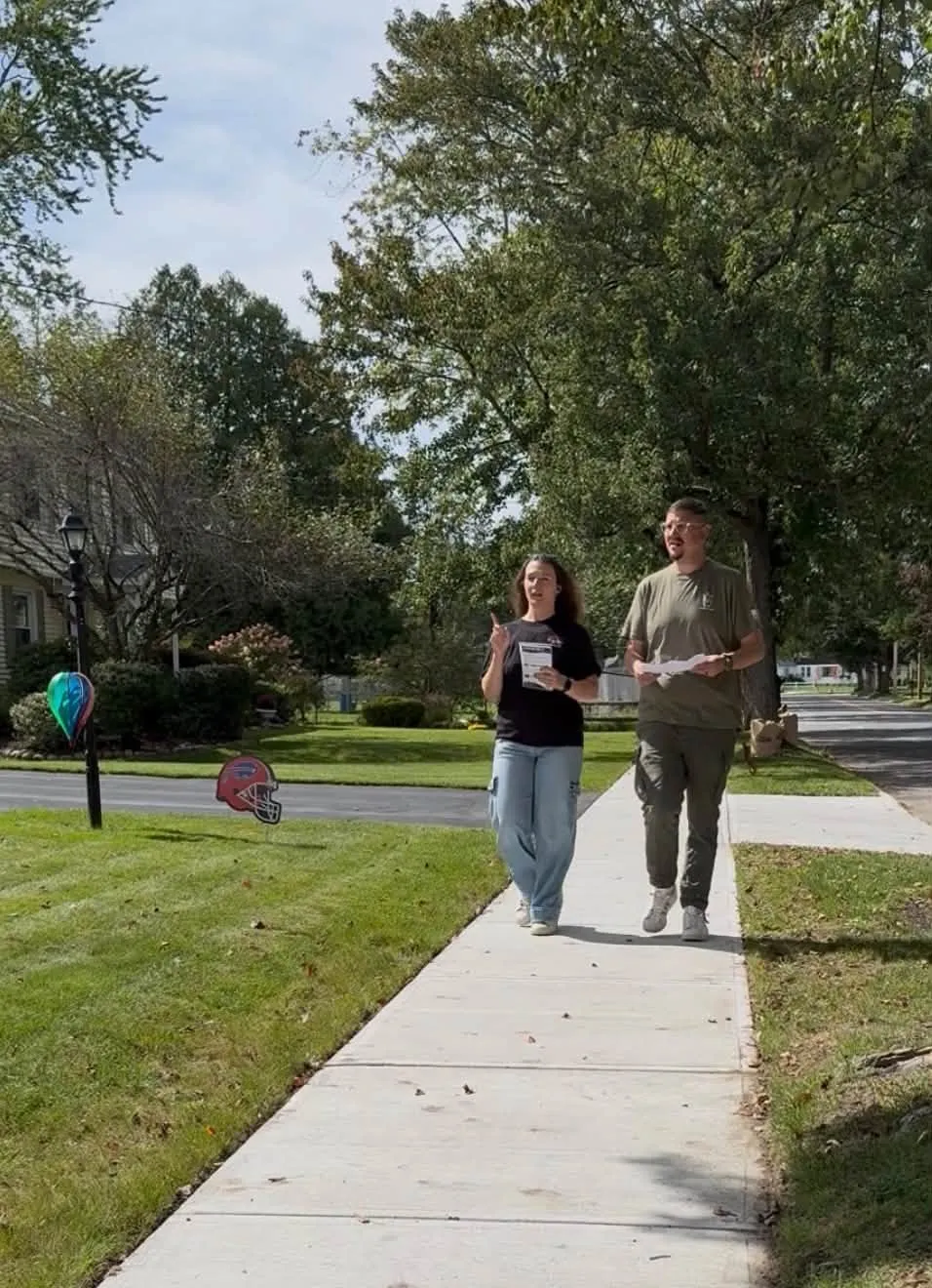 two volunteers walking at labor walk