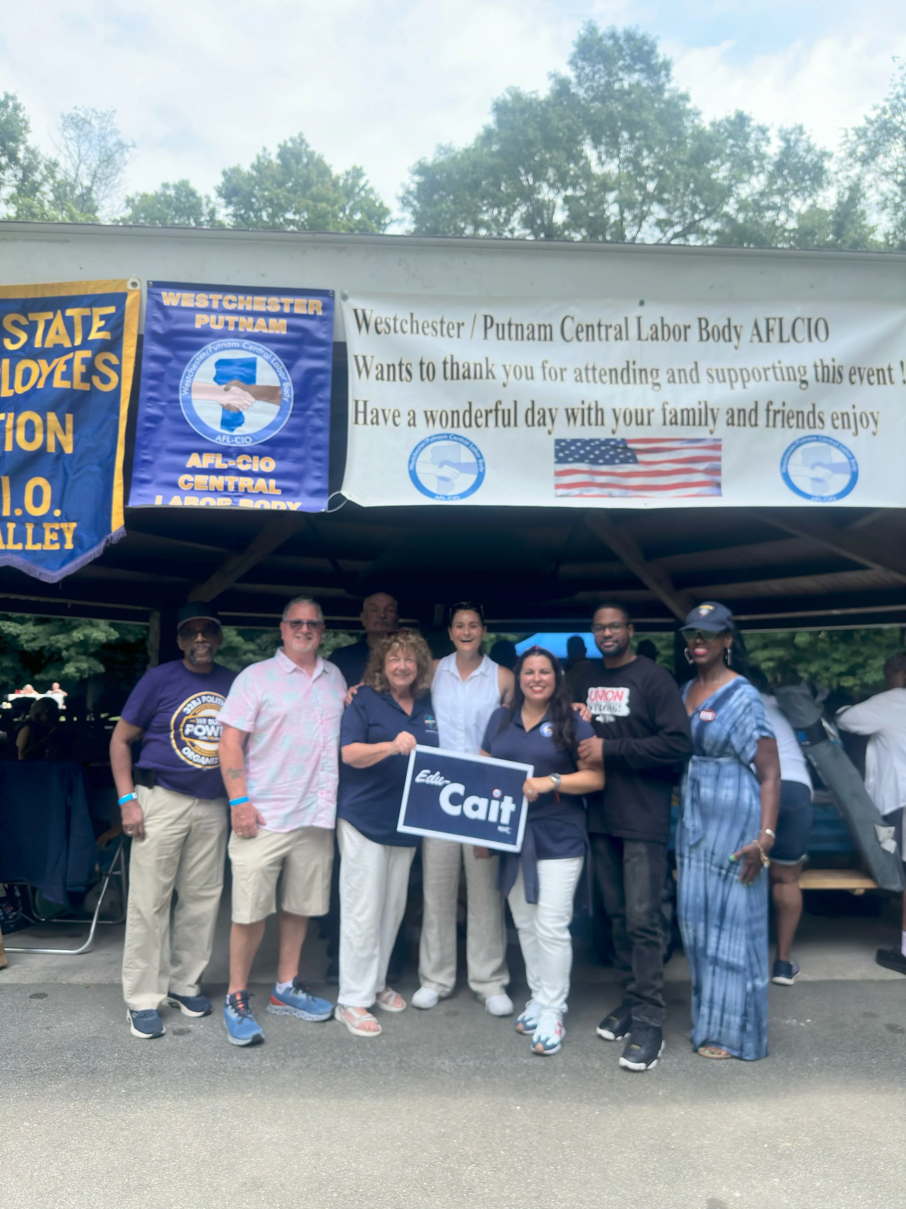 candidate and union members posing for photo